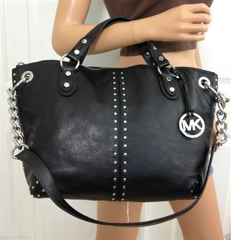 michael kors black purse with silver hardware|Michael Kors silver metallic purse.